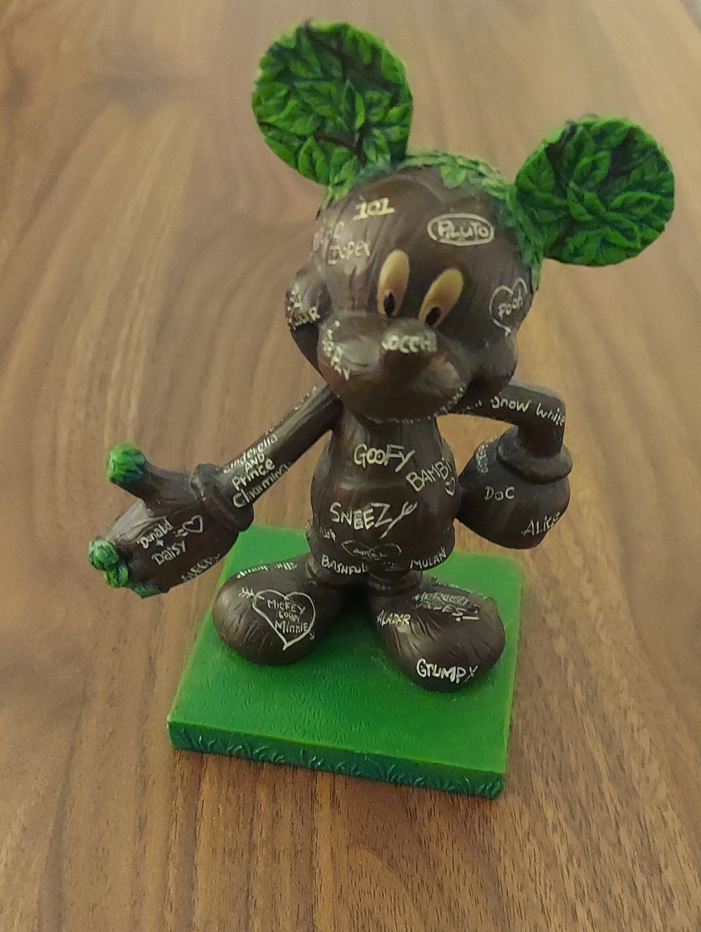 Disney Brown Figurine with Green Leaf Ears and Base - Handpainted Script Accent